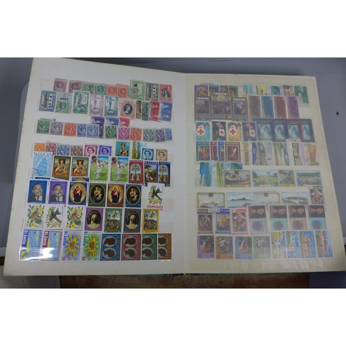 677 - Three stamp albums including Singapore, St. Lucia, Seychelles, British Solomon Islands, Pakistan, Rh... 