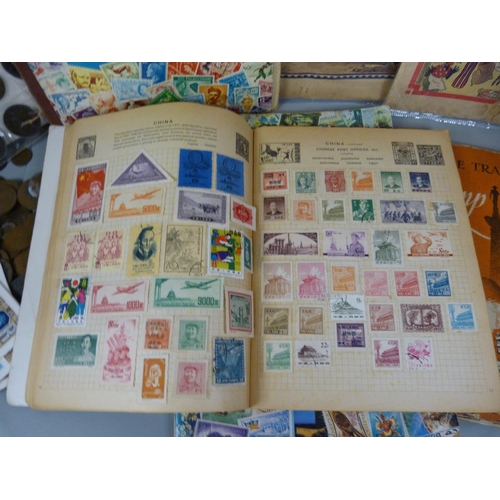 680 - Four stamp albums, a folder of coins, loose coins and two comics from 1940