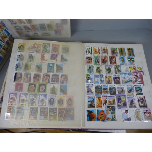 682 - Three stamp albums including South Africa, Egypt, Gambia, Dominica, Tanzania, Tonga, etc.