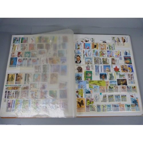 682 - Three stamp albums including South Africa, Egypt, Gambia, Dominica, Tanzania, Tonga, etc.