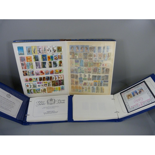 688 - Three stamp albums, two Stanley Gibbons Silver Jubilee and an album containing New Zealand and Newfo... 