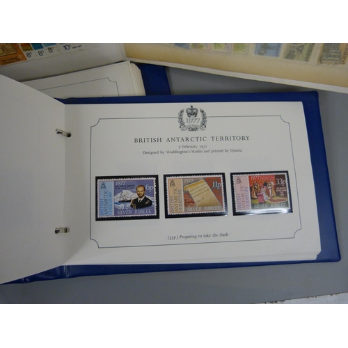 688 - Three stamp albums, two Stanley Gibbons Silver Jubilee and an album containing New Zealand and Newfo... 