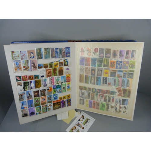 688 - Three stamp albums, two Stanley Gibbons Silver Jubilee and an album containing New Zealand and Newfo... 