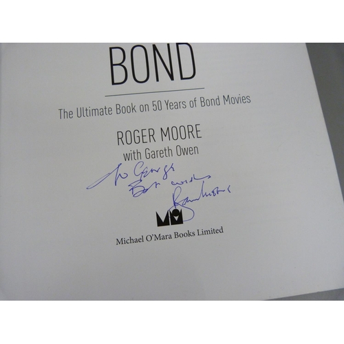 696 - James Bond; Roger Moore autographed book