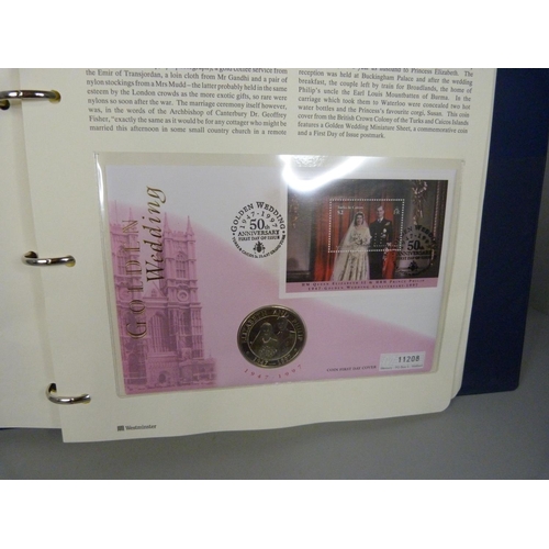 704 - An album of Royal Family commemorative coin covers