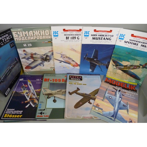 729 - A collection of paper plane sets/kits, twenty including Spitfire and Mustang