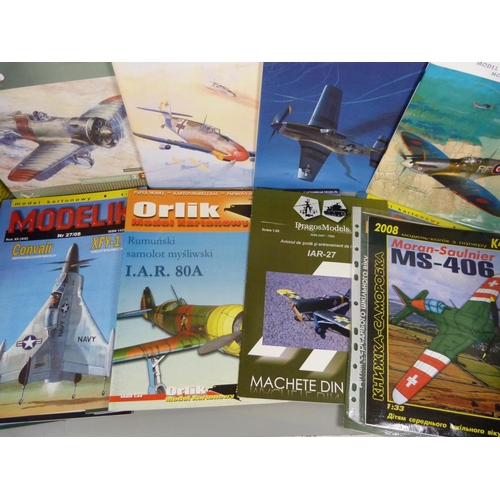 729 - A collection of paper plane sets/kits, twenty including Spitfire and Mustang