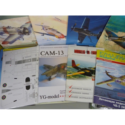 729 - A collection of paper plane sets/kits, twenty including Spitfire and Mustang