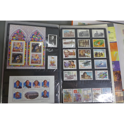 767 - A collection of stamps, some sheets, in four albums