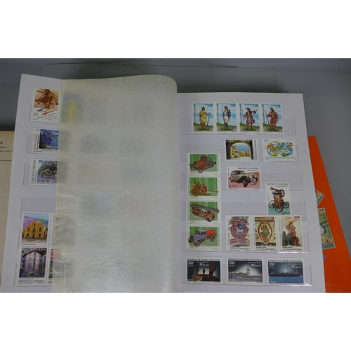 767 - A collection of stamps, some sheets, in four albums