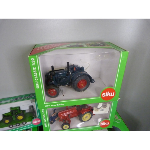 785 - Eight Siku die-cast model tractors, boxed