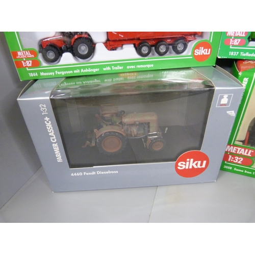 785 - Eight Siku die-cast model tractors, boxed