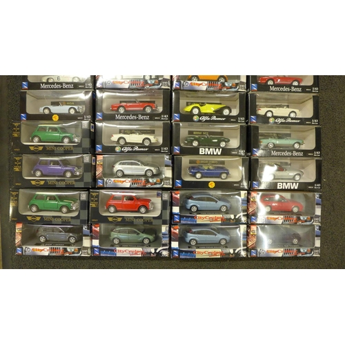 809 - A collection of die-cast model vehicles, New Ray sports cars, etc., boxed (33)