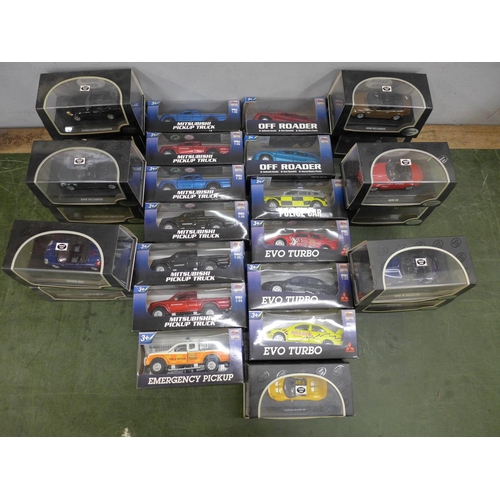 811 - A collection of twenty-six die-cast model vehicles including Mitsubishi Pickup Trucks, Evo Turbo Off... 