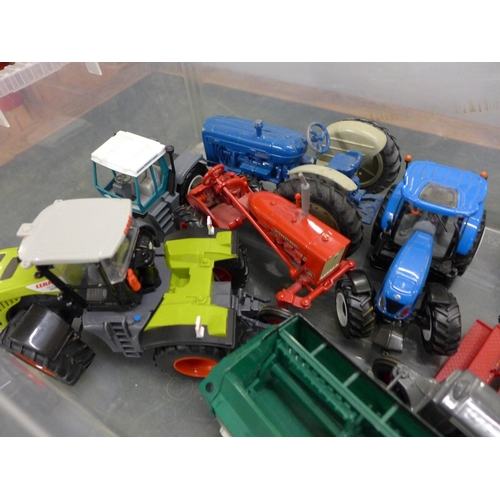 830 - A box of Britains and other models of tractors