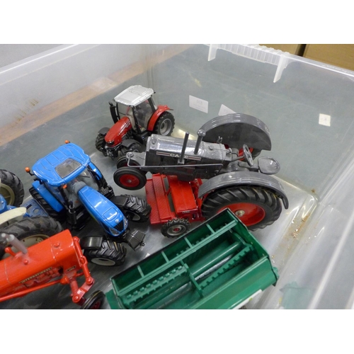 830 - A box of Britains and other models of tractors