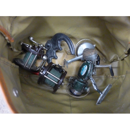 2281 - Fishing box with floats, flies, weights, net, fishing bag with rods, net and bag of approx 10 reels