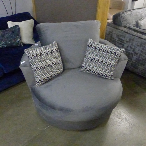 1360 - A pewter velvet swivel armchair