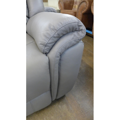 1420 - A grey leather three seater/cinema sofa and a two seater and armchair with footstool * this lot is s... 