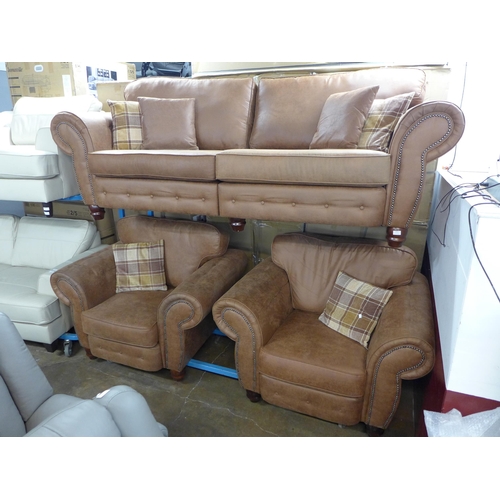 1421 - A County tan upholstered four seater sofa and a pair of armchairs * this lot is subject to VAT