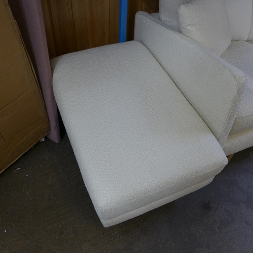 1457 - A white/cream textured weave upholstered four seater, two seater sofa and a footstool