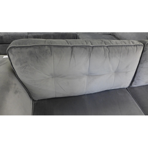 1463 - A grey velvet three seater sofa on dark legs