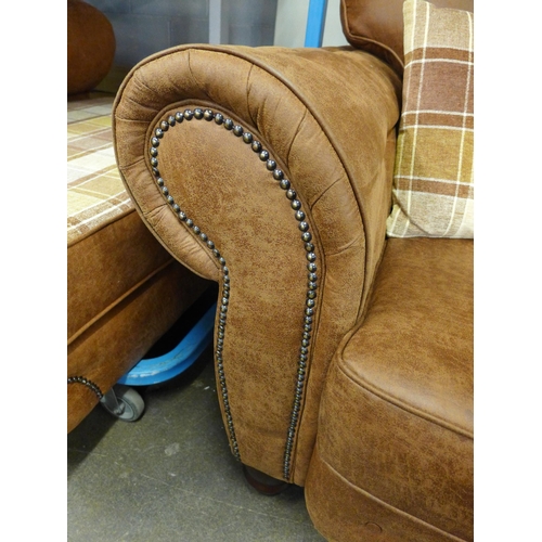 1474 - A County tan upholstered and studded love seat* this lot is subject to VAT