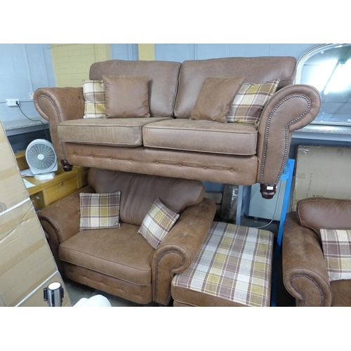 1474 - A County tan upholstered and studded love seat* this lot is subject to VAT