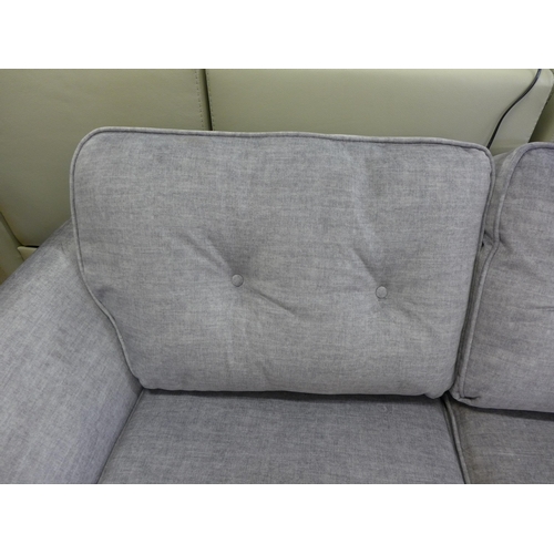 1479 - A grey velvet button back two seater sofa *This lot is subject to VAT