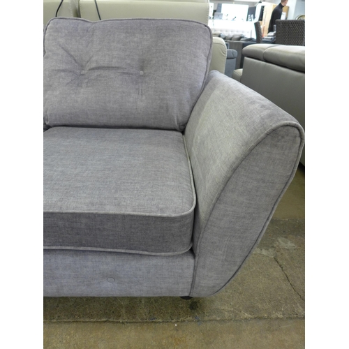 1479 - A grey velvet button back two seater sofa *This lot is subject to VAT