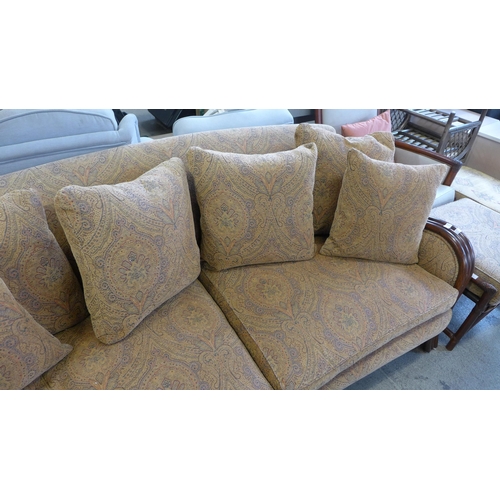 1537 - A rattan and paisley upholstered 3.5 seater sofa, chair and footstool, a rattan and leather side cha... 