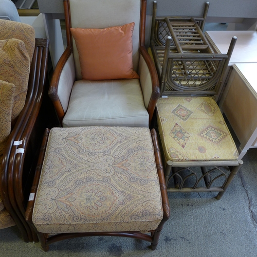 1537 - A rattan and paisley upholstered 3.5 seater sofa, chair and footstool, a rattan and leather side cha... 