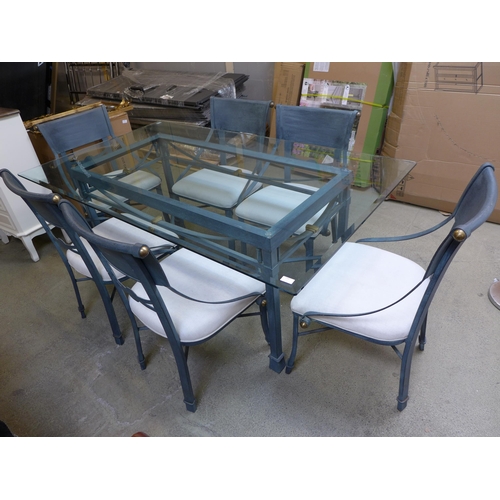 1560 - A black metal and glass top table and a set of six chairs