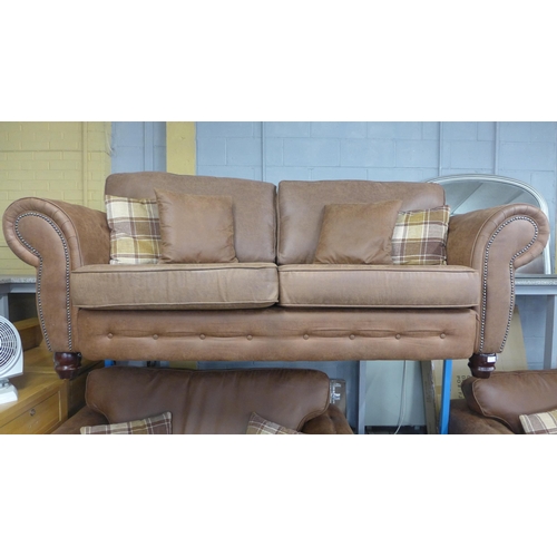 1475 - A County tan upholstered three seater sofa and love seat with tartan print footstool * this lot is s... 