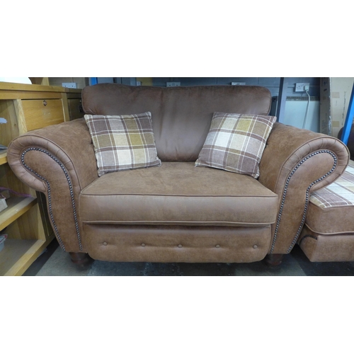 1475 - A County tan upholstered three seater sofa and love seat with tartan print footstool * this lot is s... 