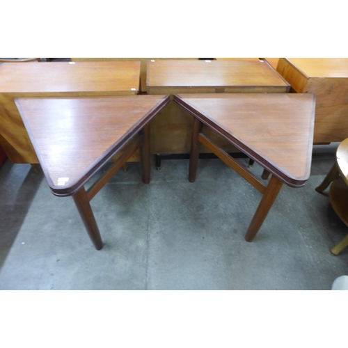 81 - A pair of Danish teak triangular side tables