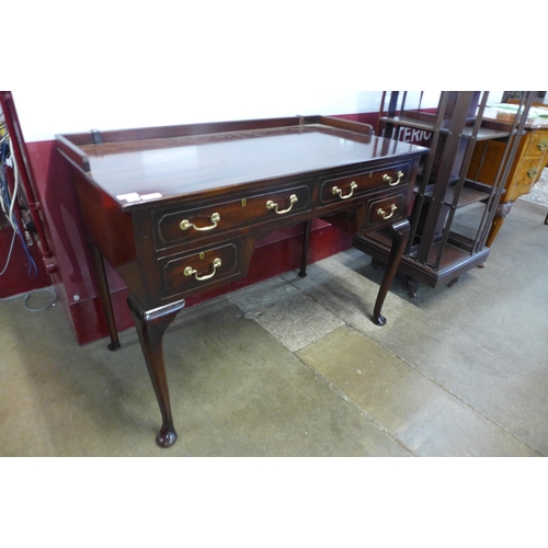 28 - An Edward VII mahogany four drawer writing table