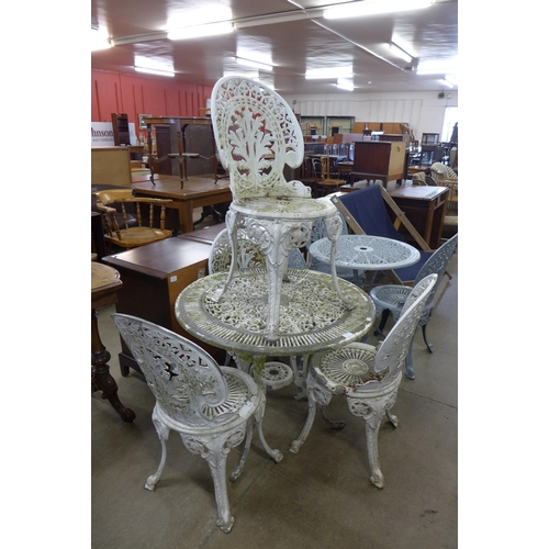 251 - A painted cast aluminium garden table and four chairs