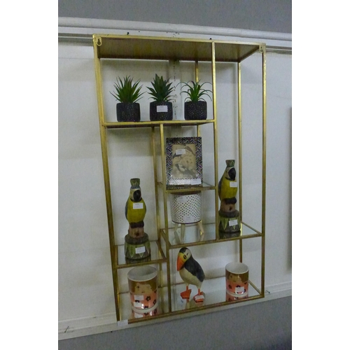 1331 - A gold mirrored wall shelf unit