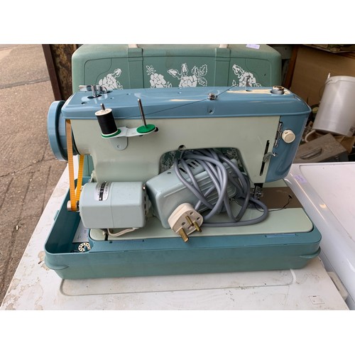 2140 - Jones electric sewing machine in case