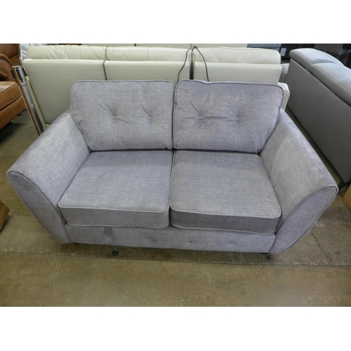 1353 - A grey velvet button back two seater sofa *This lot is subject to VAT