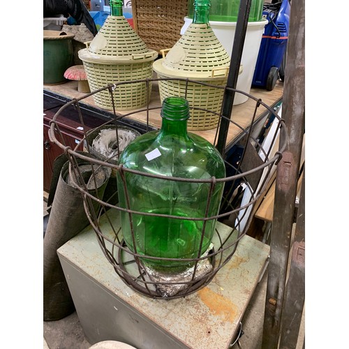 2124 - Green glass carboy jar in steel cage