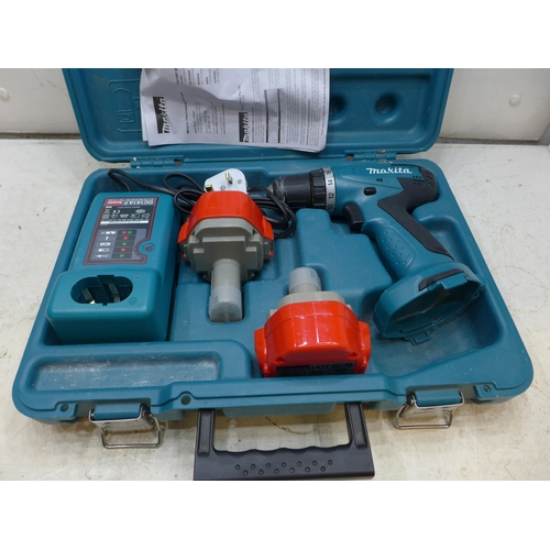 2028 - Makita 14v cordless drill with two batteries and charger in case