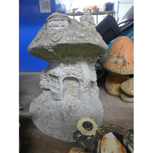 2125 - 4 Stone toadstools, glazed planter and 2 items of cast metal