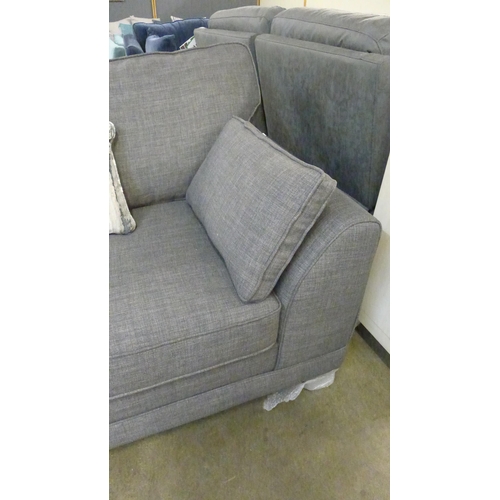 1381 - A charcoal upholstered two seater sofa
