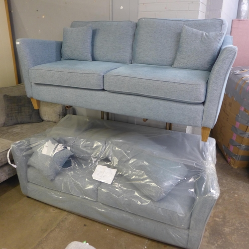 1392 - A pair of sky blue upholstered three seater sofas
