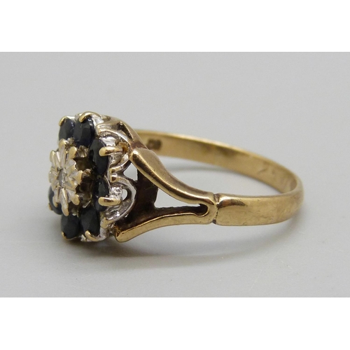 1008 - A 9ct gold, sapphire and diamond cluster ring, 3.2g, N, one sapphire a/f