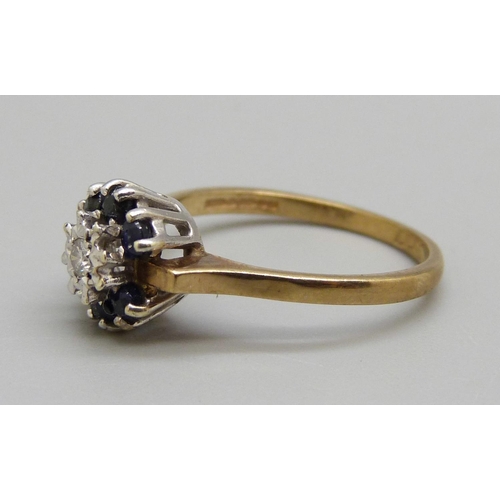 1009 - A 9ct gold, sapphire and diamond cluster ring, 2.4g, M