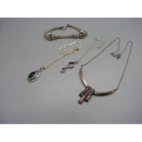 1051 - A silver bracelet and three silver necklets