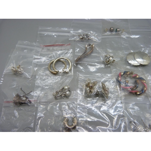 1056 - A collection of pairs of silver earrings